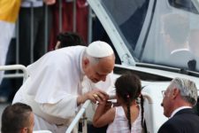 a girl with a rosary